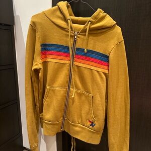 Aviator Nation Zip Up khaki colored with rainbow stripe